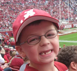 Child smiling at a football game