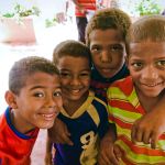 Four boys smiling - Dental Mission in the Dominican Republic